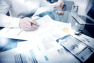 Sales Management Time Process.Photo Banker work market report documents.Use electronic devices.Work graphics icons,stock exchanges reports interfaces.Business project startup.Horizontal,film effect