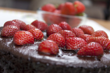 Chocolate fudge cake topped with ripe strawberry's