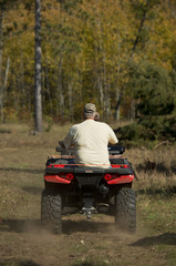 Grandfather and Grandson Riding ATV's