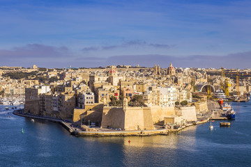 Malta - Aerial view of the ancient walls of Senglea and Gardjola Gardens shot from Valletta on a...