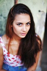 portrait of a beautiful brown-haired girl with big eyes and a calm look.