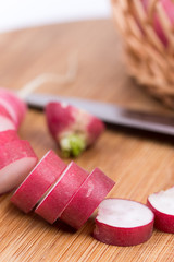 Sliced radishes on the wooden board