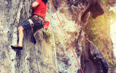 rock climber climbing on the cliff