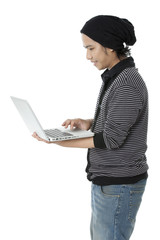 side view of a boy with laptop.