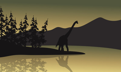 Silhouette of brachiosaurus in riverbank