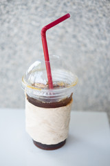 Black coffee with ice on table