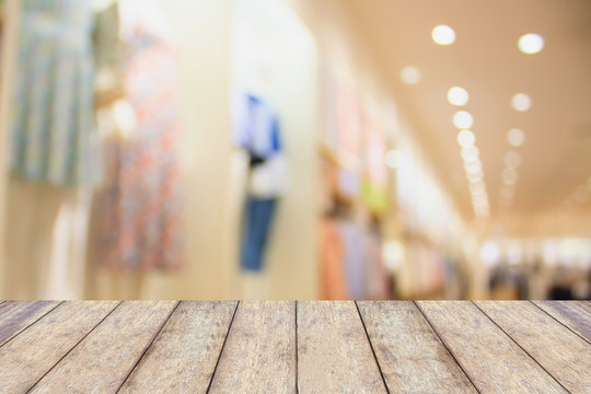 Empty table and blur clothing store with bokeh background