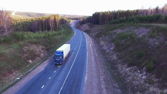 Aerial view of trucks on the road.