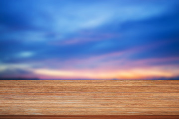 Top of wooden table on blue sunset sky background