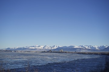 View of Cook Inlet with down town Anchorage in the winter.