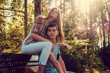 Loving adult couple in summer park.