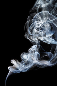 Abstract white blue smoke from aromatic sticks.