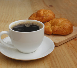 Cup of coffee and Croissant Breakfast Fast