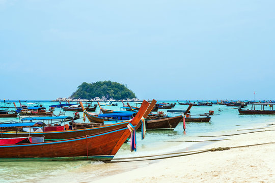 Passenger boats parked on the beach in Lipe island, Thailand