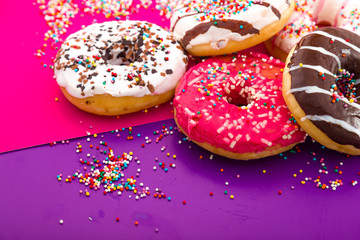 Donuts on color background.