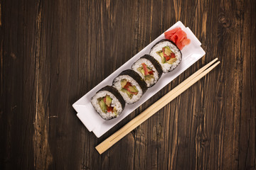 Vegetarian sushi rolls with chopsticks