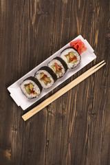 Vegetarian sushi rolls with chopsticks