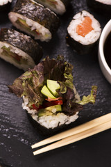 Assortment of sushi rolls with salmon and vegetables