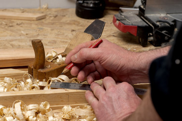 carpenter working,hammer,meter and screw-driver on construction background