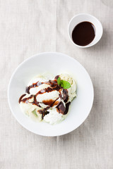 Vanilla and pistachio ice cream with chocolate top view