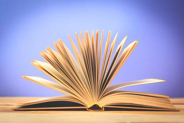 Vintage old books on wooden deck table