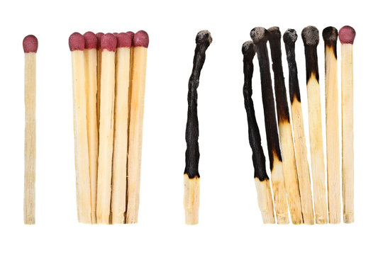 new and half-burnt matches on a white isolated background