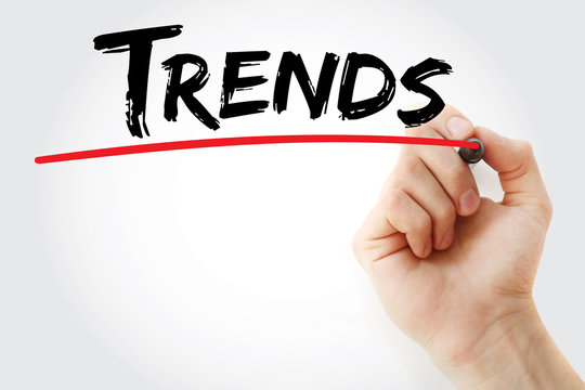 Hand writing Trends with red marker, business concept