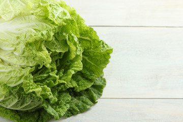 green cabbage on wooden background close-up
