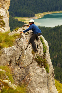 Climbing Man with Lake of Crno Jezero on Bacground, Durmitor, Mo