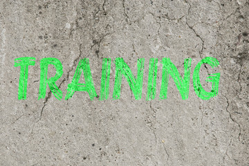 Neon green word text Training business concpet on a concrete background