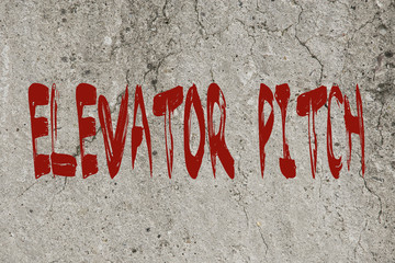 Red word text elevator pitch business concpet on a concrete background