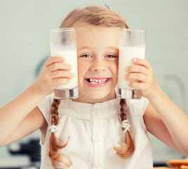 Child drinking milk at home