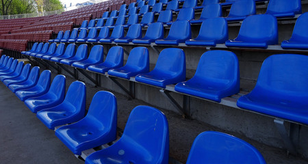 Fototapeta premium Plastic seating section on the grandstand of sport stadium