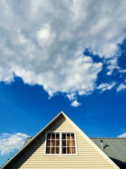 Countryside house roof against the sky
