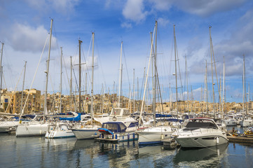 Fototapeta na wymiar Malta - Yacht marina at Birgu with blue sky and clouds
