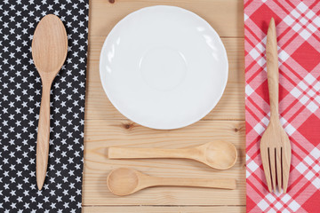 Color tablecloth, spoon, fork on  table background