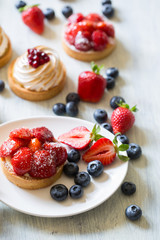 Fresh berry tarts with strawberry and blueberry 