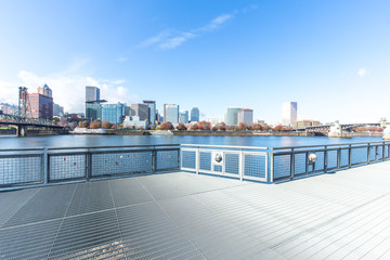 empty footpath on bridge with cityscape and skyline of portland
