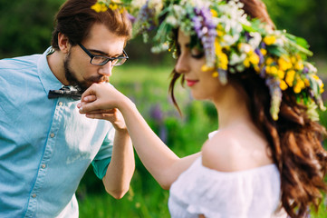 handsome guy with a beard in a blue denim shirt gentle kiss