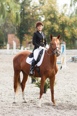 Teenage girl winning in equestrian competition