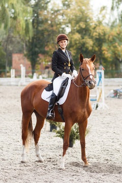 Teenage girl winning in equestrian competition