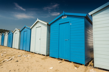 Fototapeta na wymiar Blue beach huts in row
