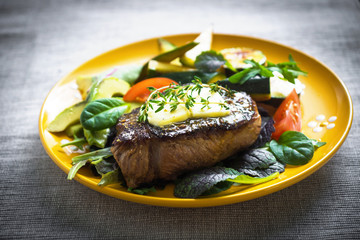 Grilled beef steak with  herb buter and vegetable