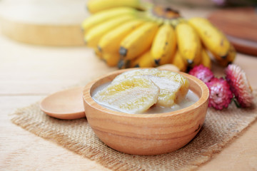 banana in coconut milk with ripe yellow banana. traditional thai dessert made from Pisang Awak...