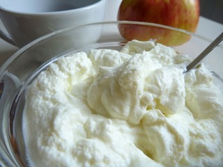 fresh cottage cheese in a glass bowl