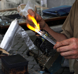 Blowing glass figurines with flame craft