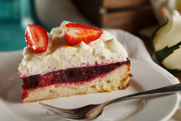 Tart with strawberries and cherry and whipped cream