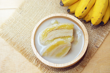 banana in coconut milk with ripe yellow banana. traditional thai dessert made from Pisang Awak banana