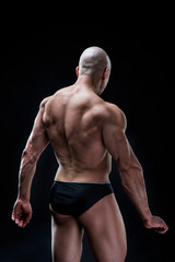 Fototapeta premium bodybuilder, bodybuilding, sports, background, black, studio