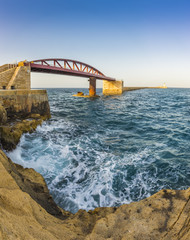 Valletta, Malta - St. Elmo Breakwater bridge and the entrance of the Grand Harbour of Valletta at sunset